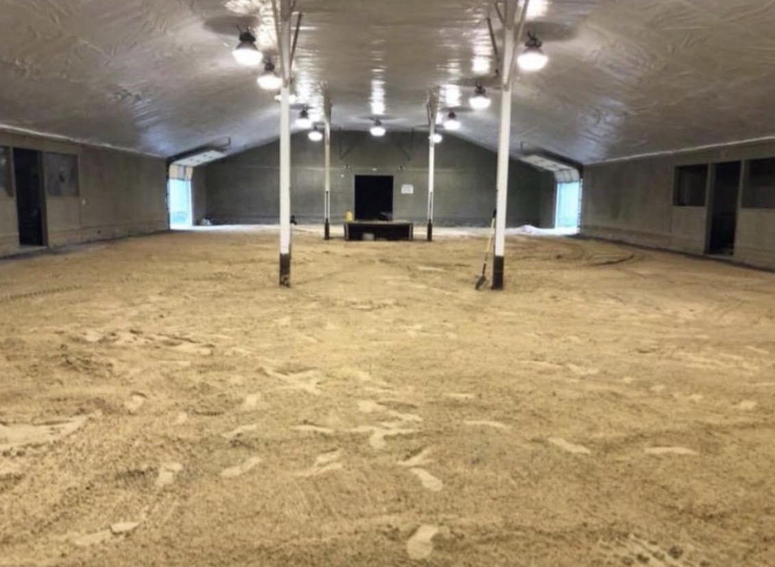 The large covered indoor arena at Stecoah Stables